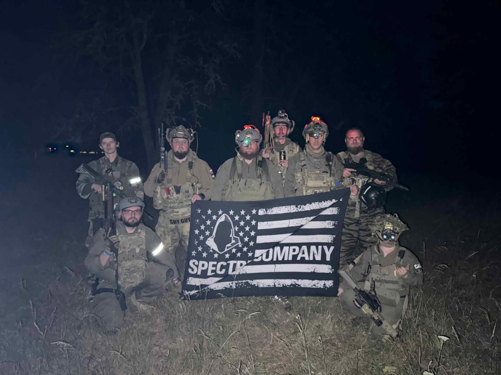 Spectre Company team at a nighttime airsoft operation